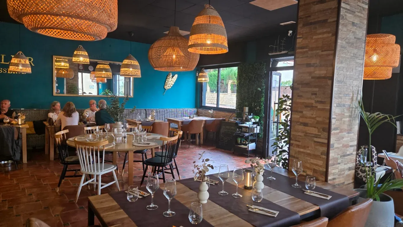 A closer view of the dining room and table settings at Brasserie Atelier